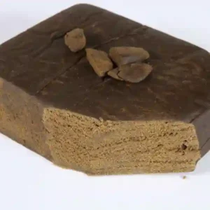 Close-up of Standard Brown Moroccan Hash with medium-brown color and firm, pliable texture.